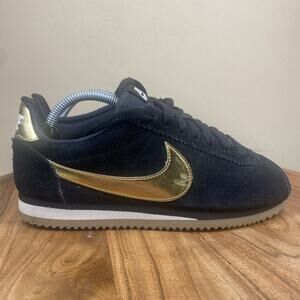 nike black & gold cortez suede trainers